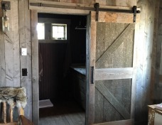 Barn Wood Slider into Bathroom