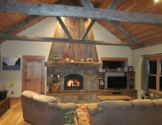 Custom Moss Rock Fireplace with Reclaimed Mantle