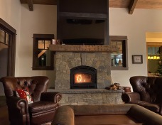 Cozy and relaxing with the fireplace doubling as a nine piece of art.