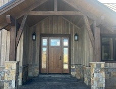 Welcoming entry with beautiful, custom front door.