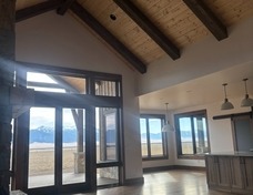 Great room with timber work and beautiful white oak floors. Natural light for days.